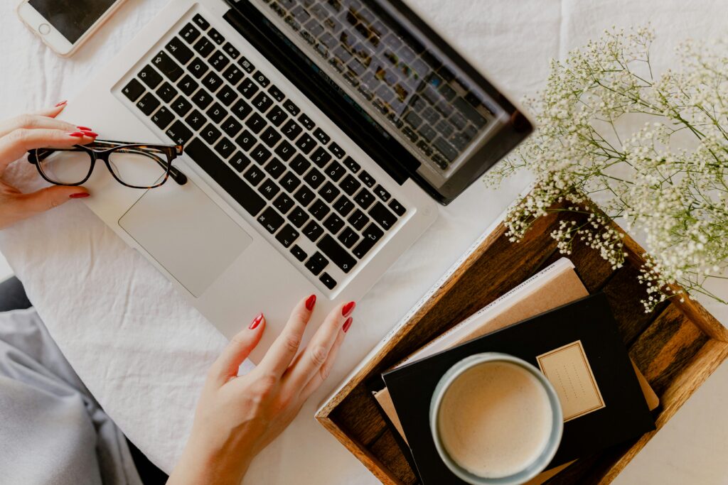 person starting an AI blog on laptop in 2026