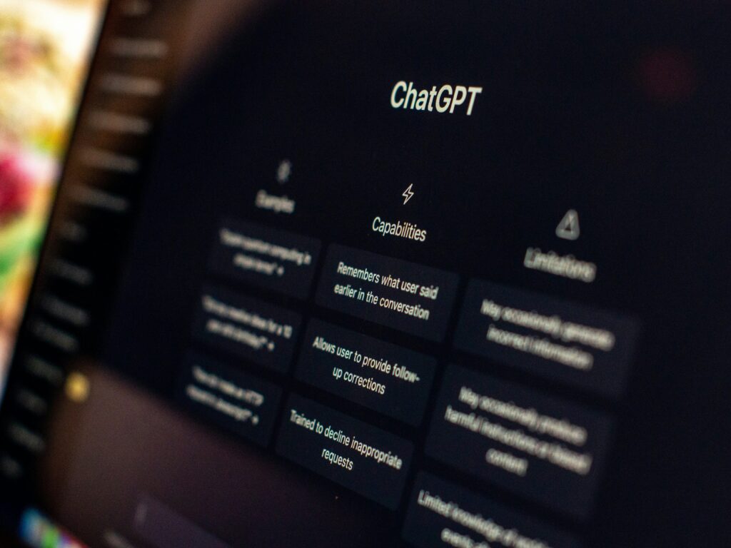 Laptop screen showing AI chatbot conversation for writing emails