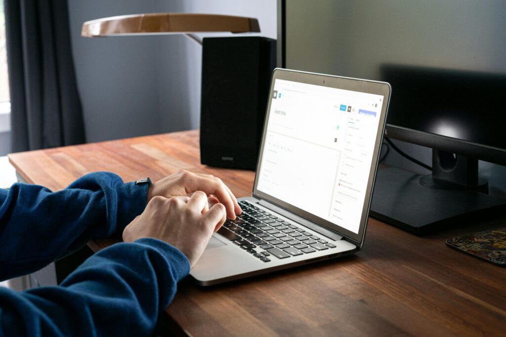 person using AI chatbot on laptop to make money online