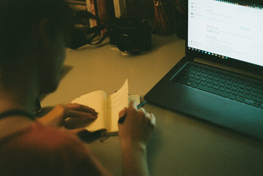 Person using AI tools to write online content at home in the evening