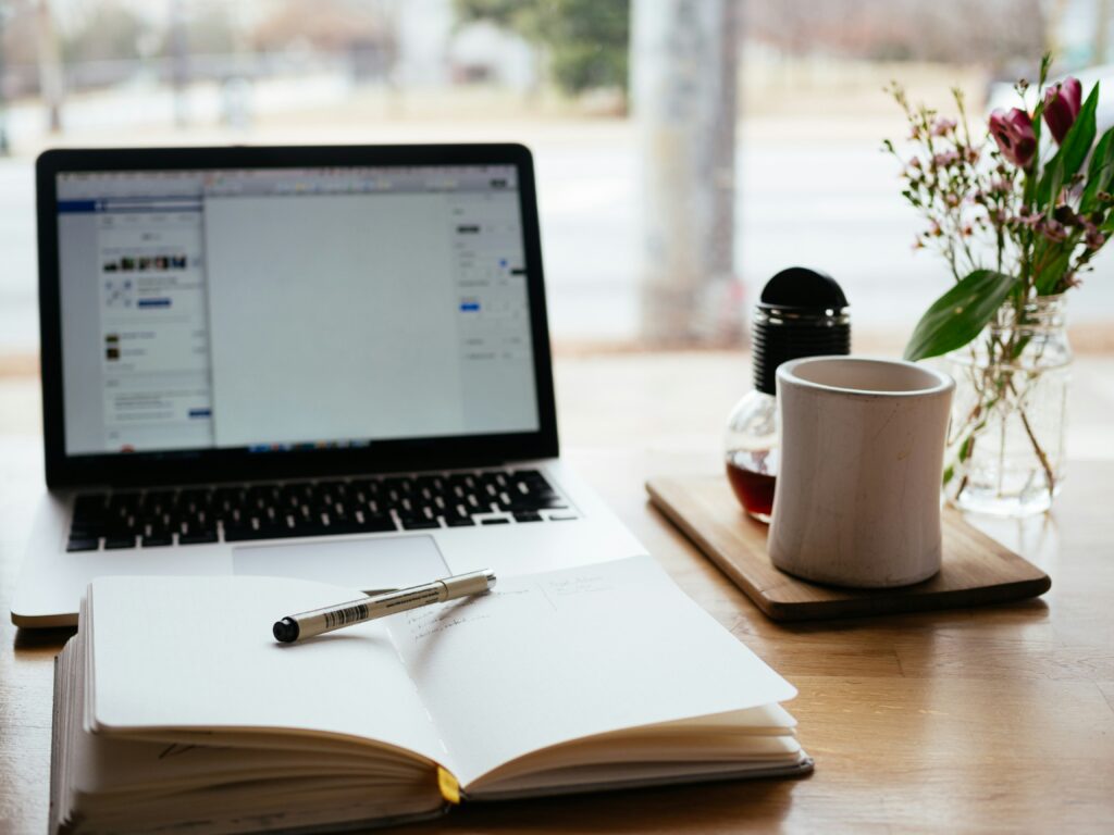  WordPress dashboard on a laptop screen, open to a new blank blog post